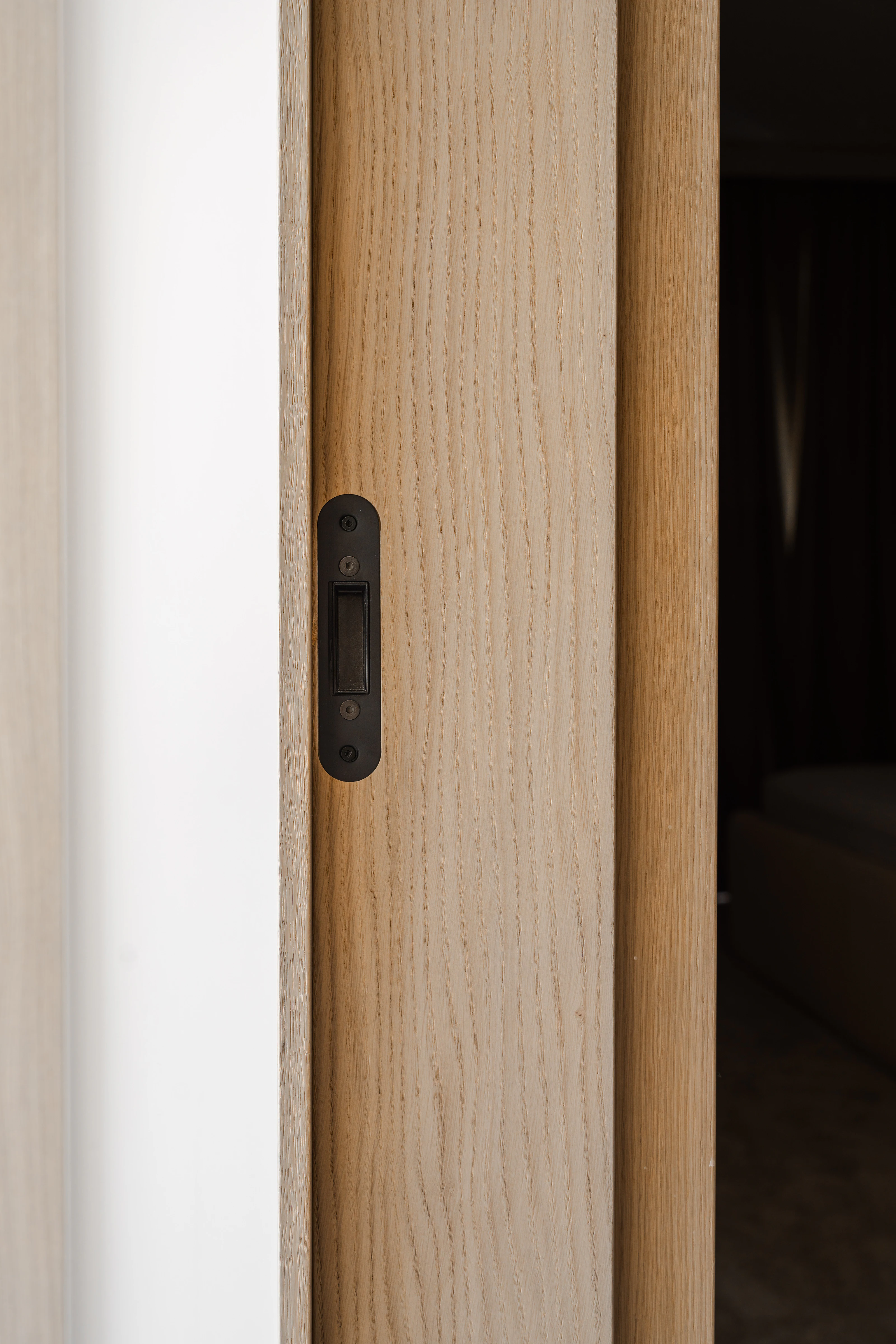 Close-up of integrated oak staircase treads and concealed lighting